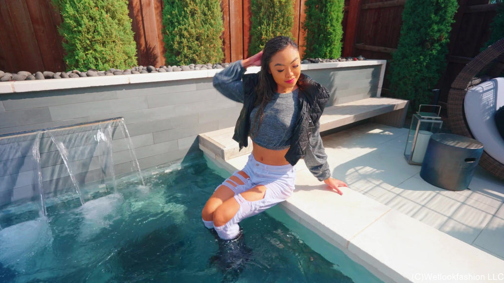 Christy Swims Wearing Jeans, Sweater, Boots and a Jacket
