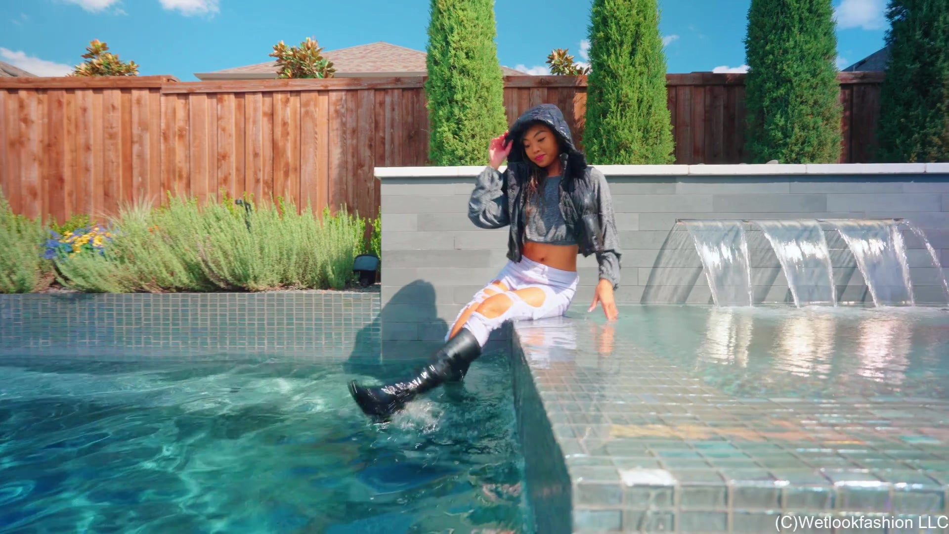 Christy Swims Wearing Jeans, Sweater, Boots and a Jacket