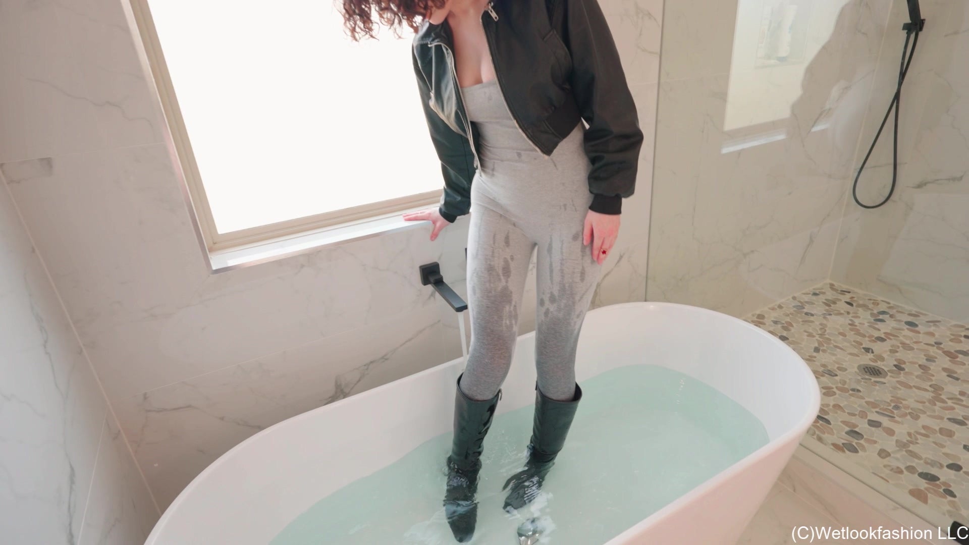 Elena Takes a Bath in a Jumpsuit, Boots and Leather Jacket