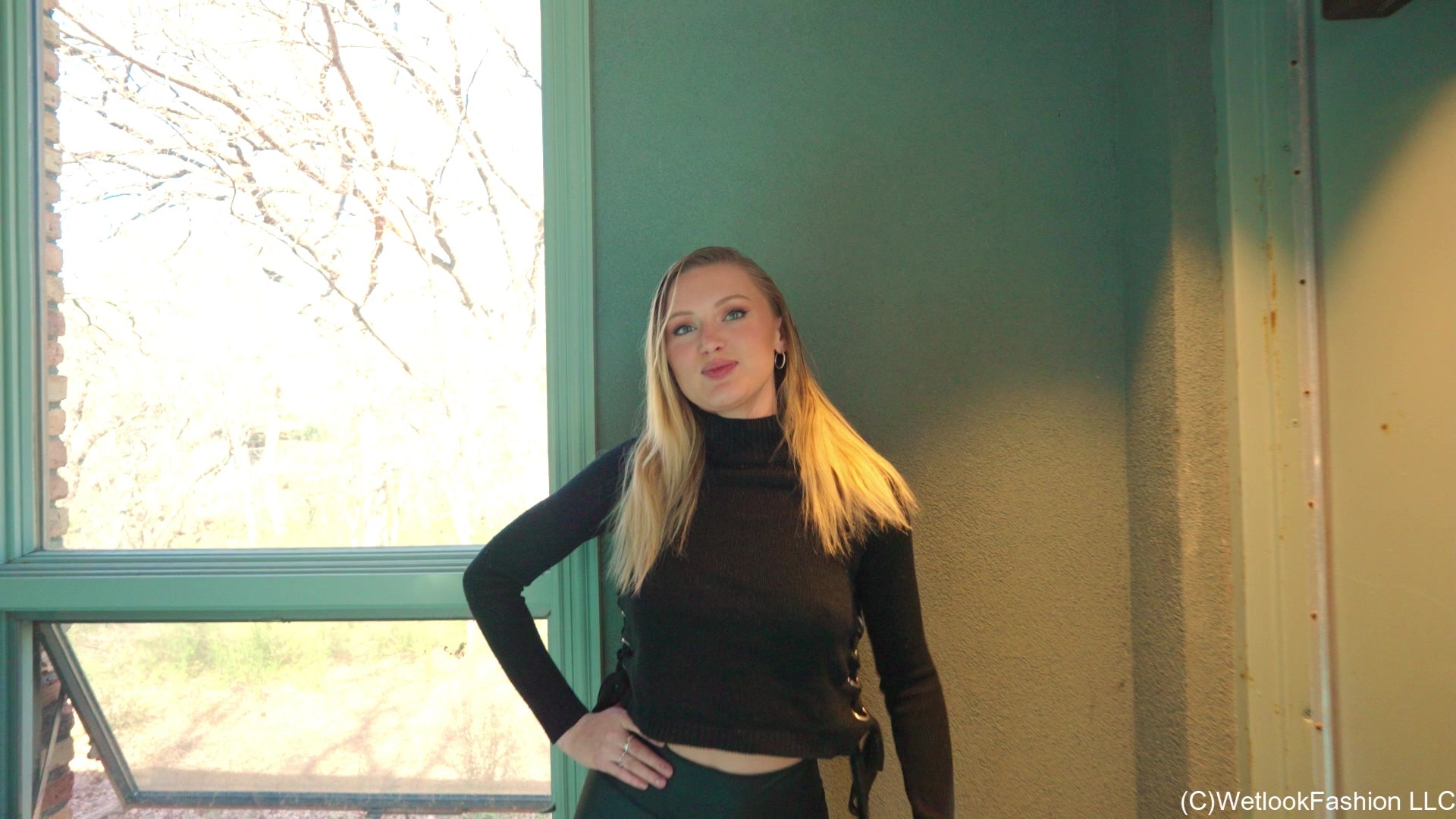 Gigi Swims Wearing Leggings and a Sweater