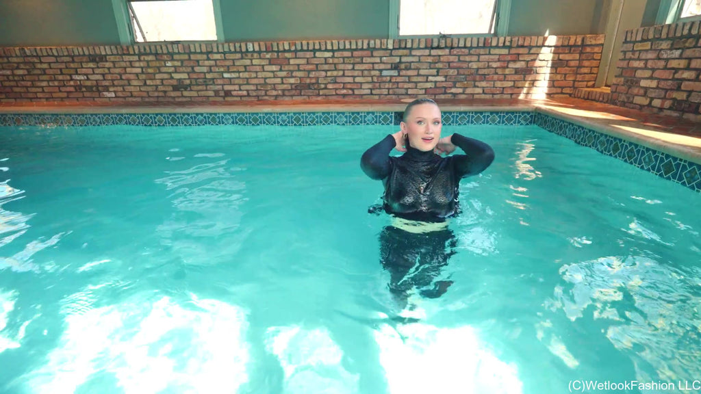 Gigi Swims Wearing Leggings and a Sweater
