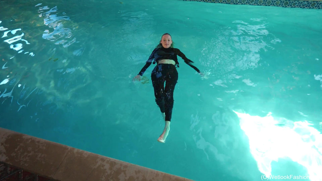 Gigi Swims Wearing Leggings and a Sweater