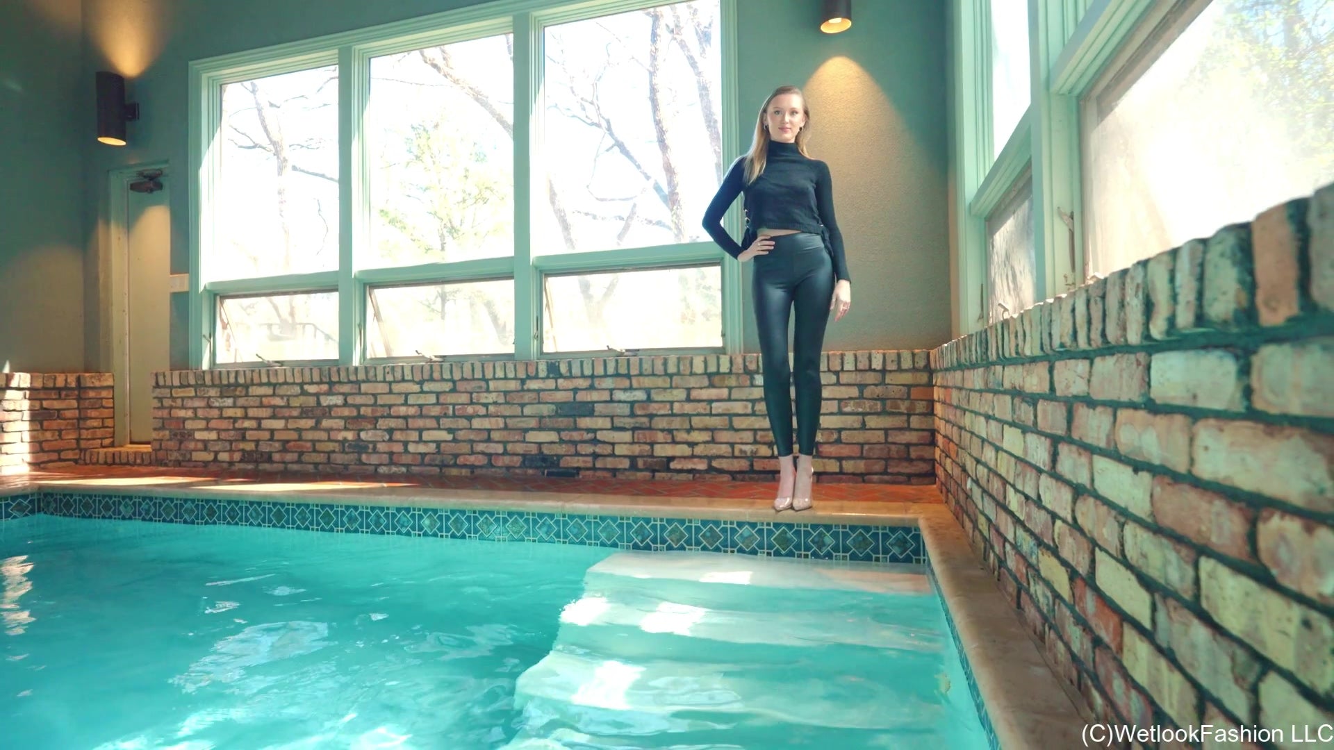 Gigi Swims Wearing Leggings and a Sweater