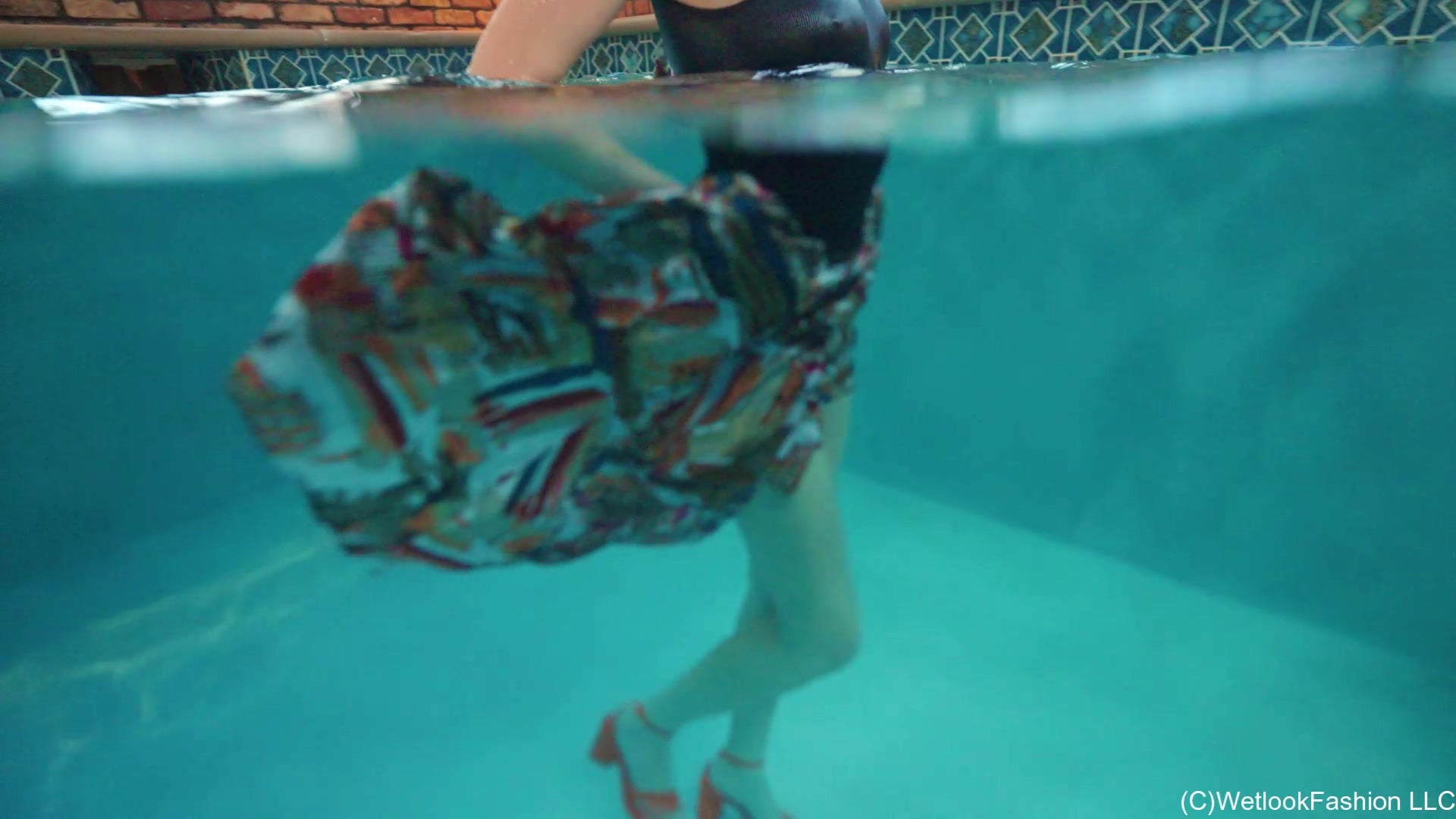 Gigi Is Swimming in a Bodysuit and a Long Satin Skirt