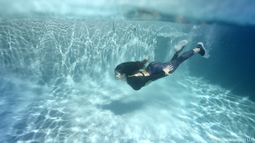 Gina Goes for a Swim in Leggings, a Shiny Top and Sneakers