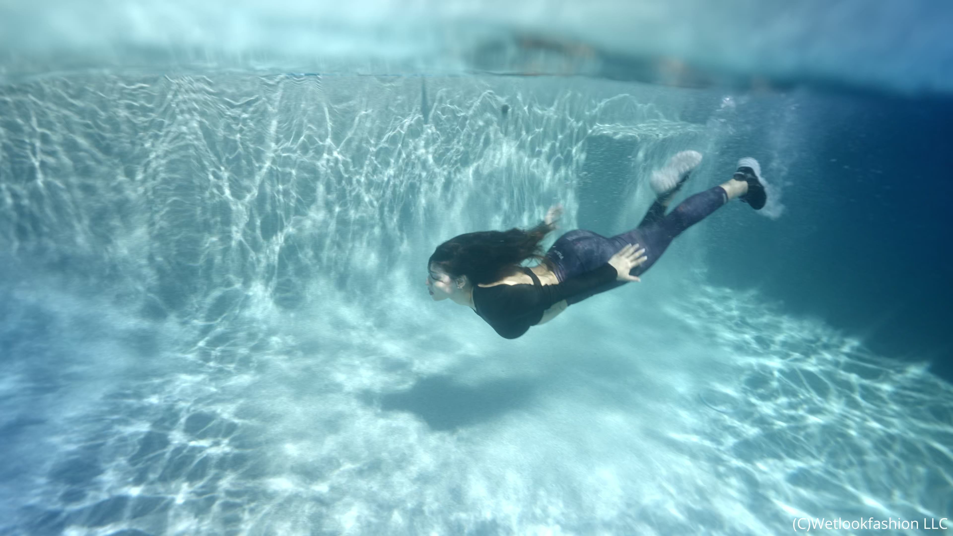 Gina Goes for a Swim in Leggings, a Shiny Top and Sneakers