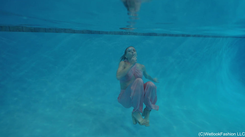 Hannah wears a Satin Set in the Pool