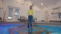 Hannah Swims in Jeans and a Yellow Crop Top