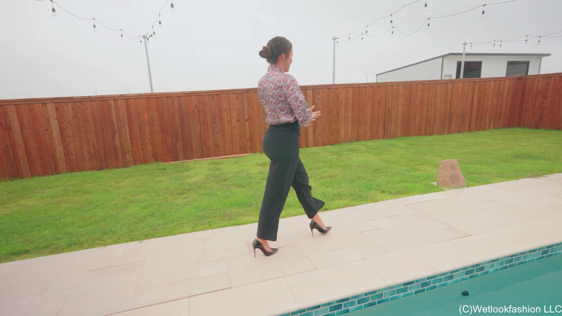 Iris Celebrates with a Fully Clothed Jump in the Pool