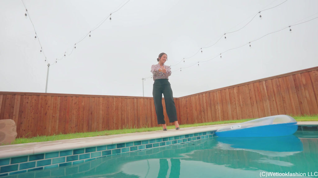 Iris Celebrates with a Fully Clothed Jump in the Pool