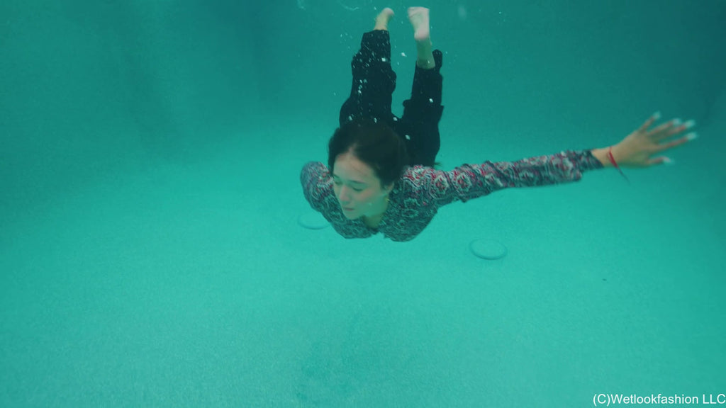 Iris Celebrates with a Fully Clothed Jump in the Pool