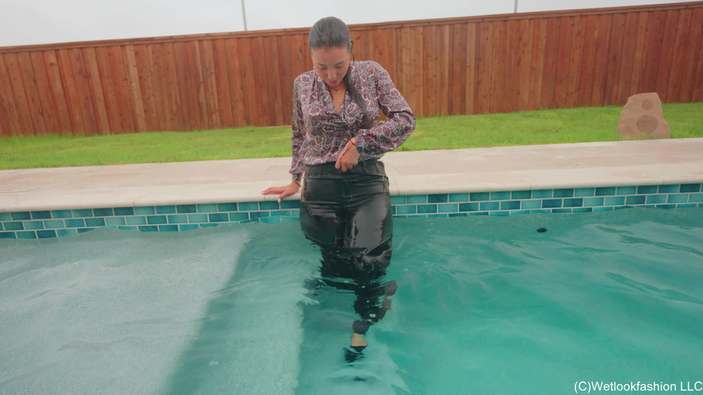 Iris Celebrates with a Fully Clothed Jump in the Pool