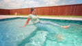Iris Swims in Tight Jeans and T-Shirt