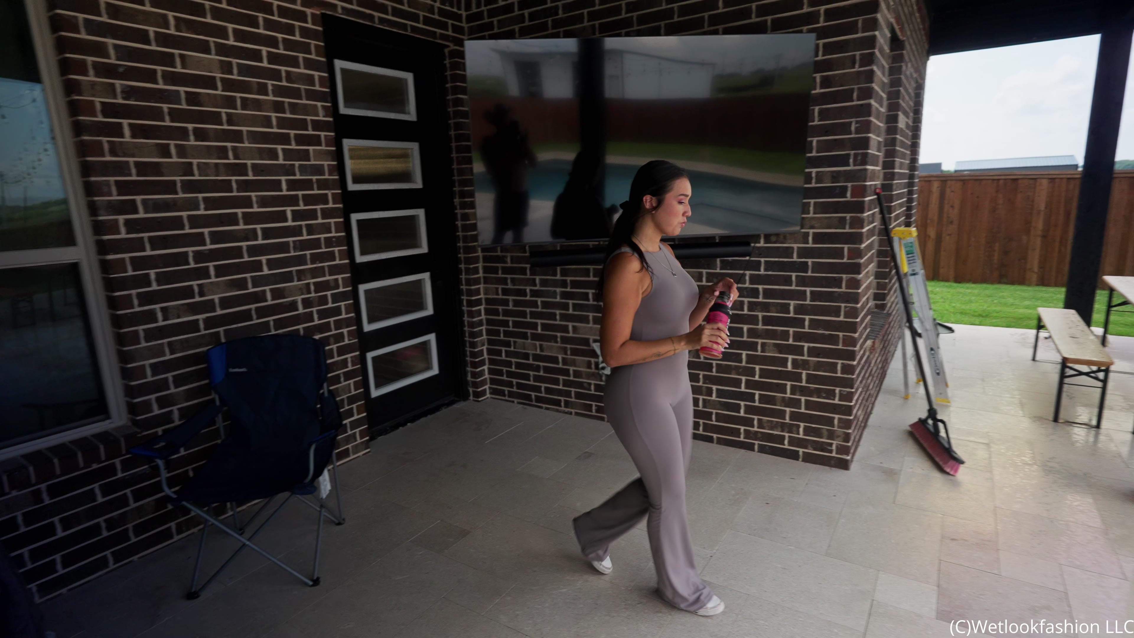Iris Soaks Her Sporty Jumpsuit in the Rain and in the Pool