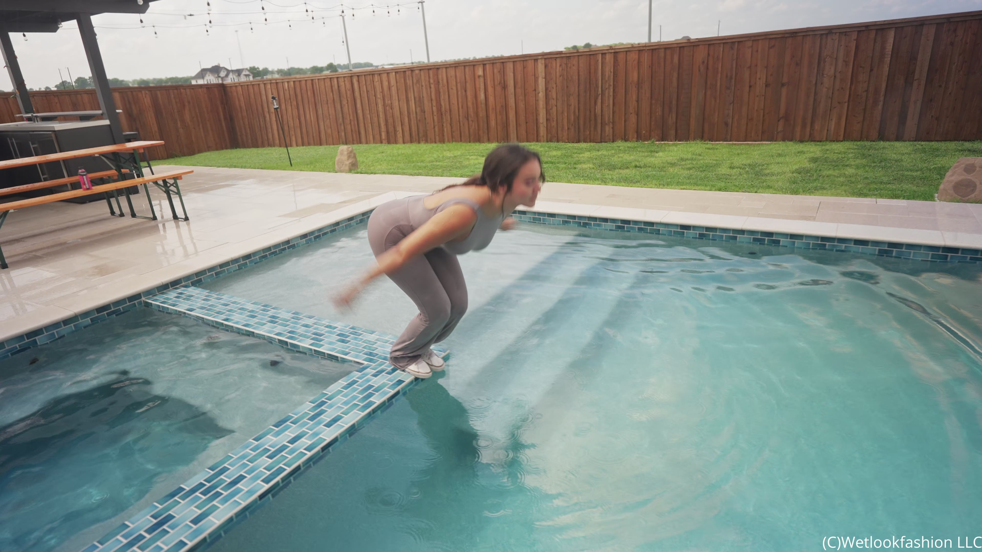 Iris Soaks Her Sporty Jumpsuit in the Rain and in the Pool