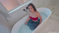 Iris takes a Bath in Jeans and Boots