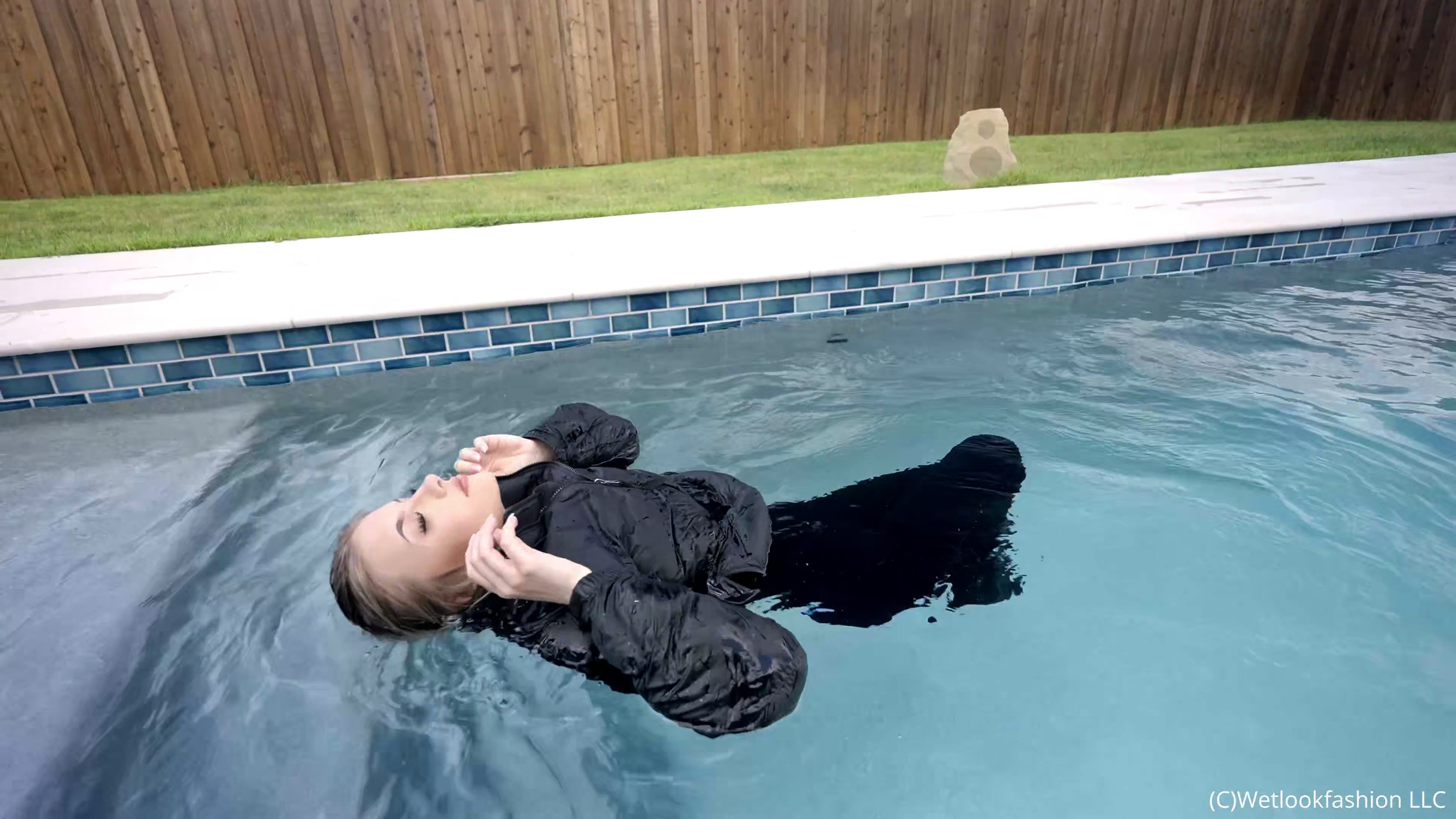 Izabella Goes for a Swim in a Jumpsuit, Jacket and Boots