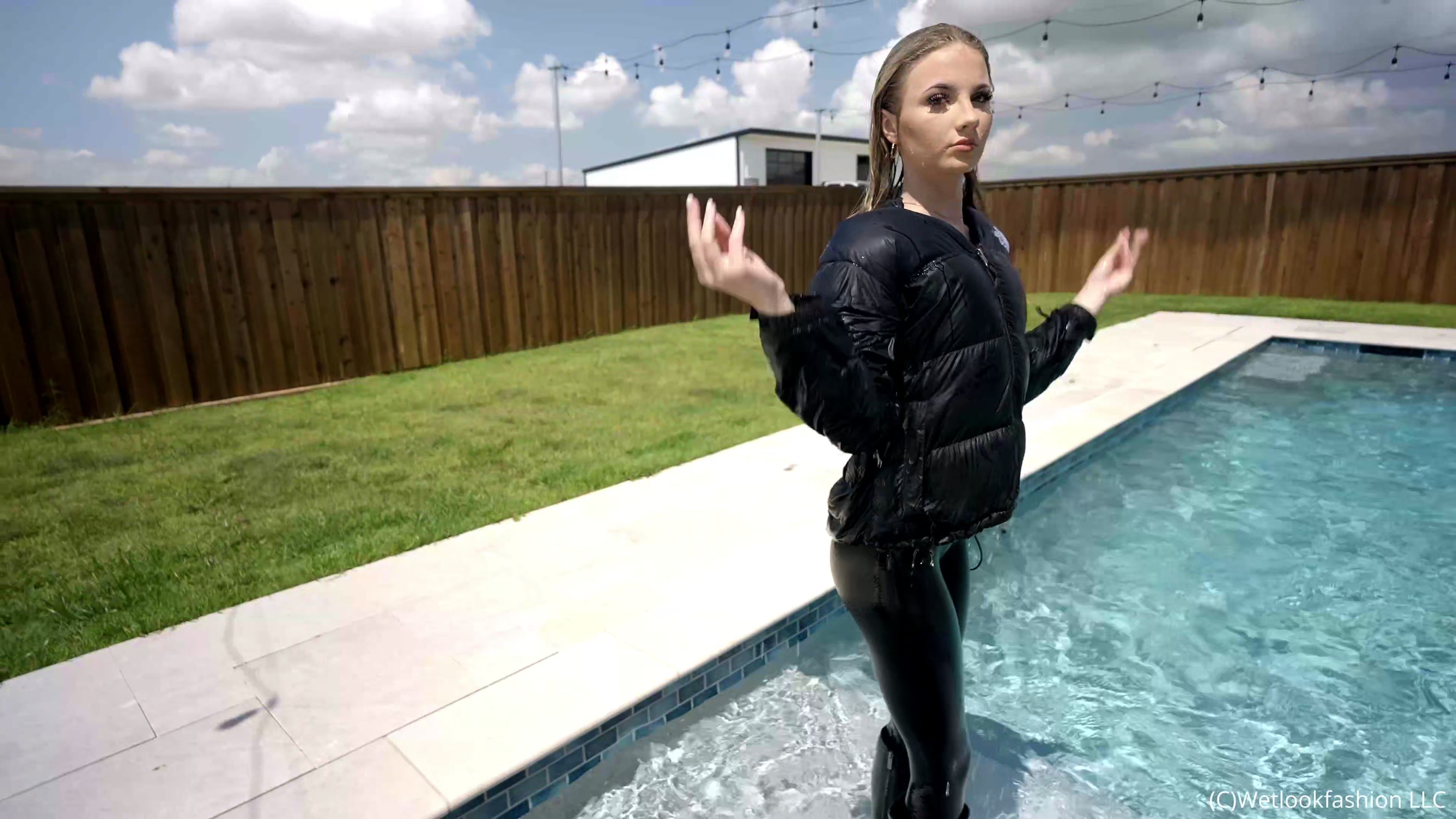 Izabella Goes for a Swim in a Jumpsuit, Jacket and Boots