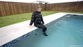 Izabella Goes for a Swim in a Jumpsuit, Jacket and Boots