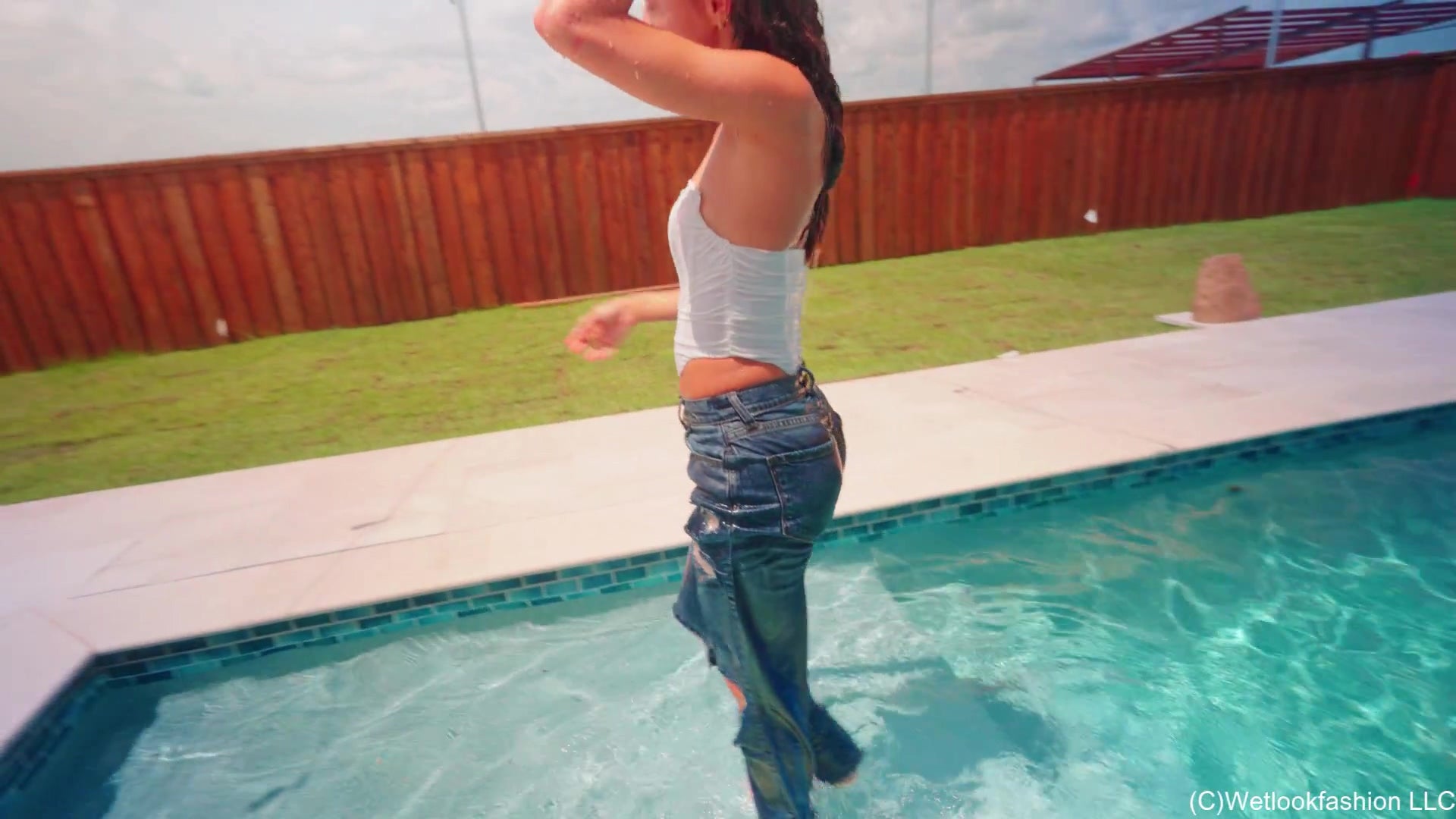 Jasmine Goes for a Swim in Jeans, a White Top and Heels