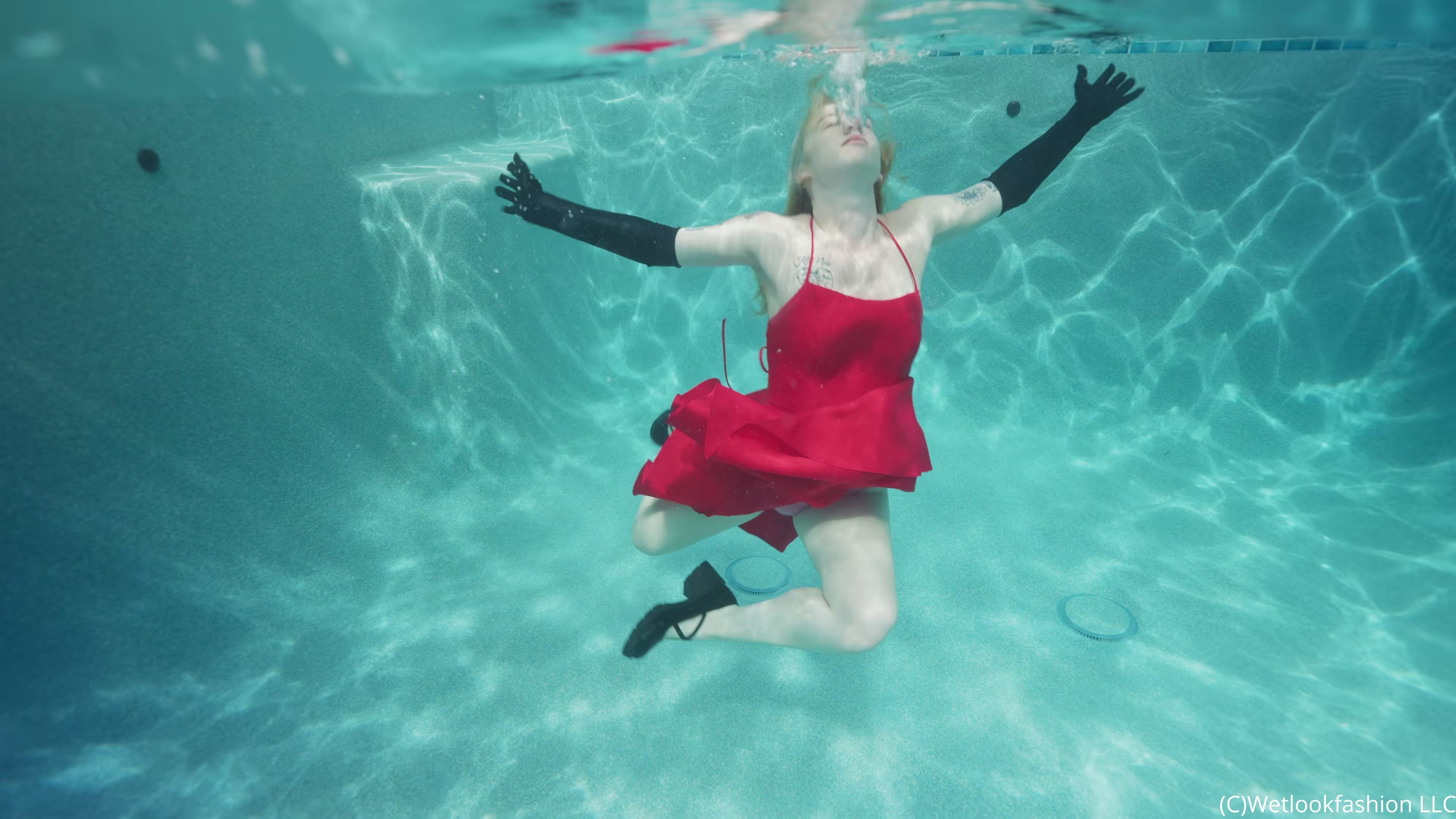 Jessica Has Some Pool Fun Wearing a Red Satin Dress