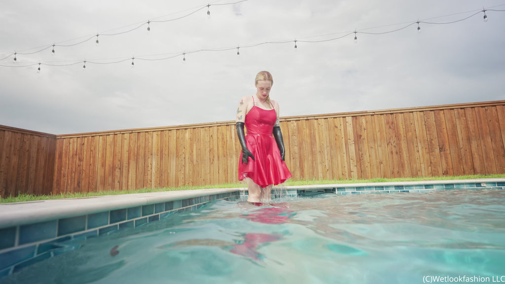 Jessica Has Some Pool Fun Wearing a Red Satin Dress