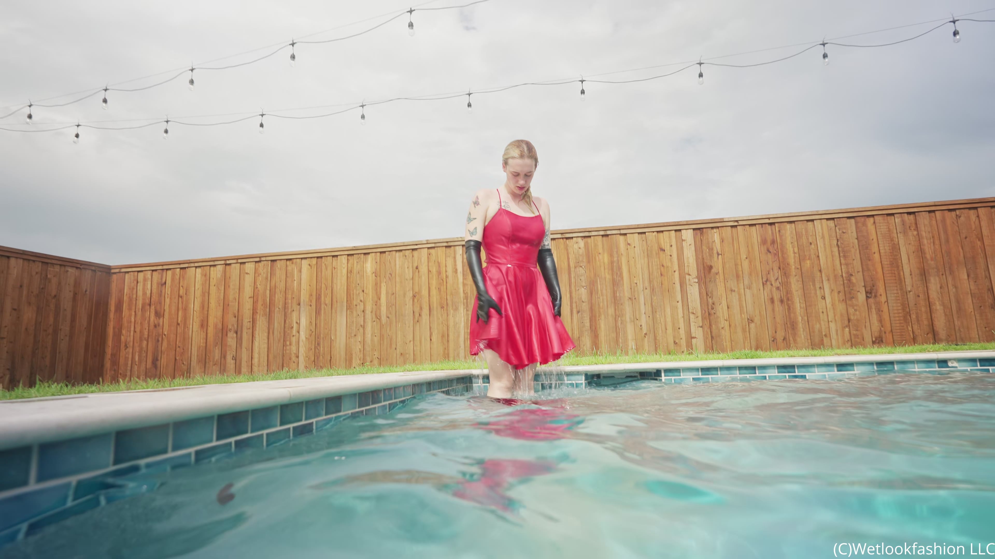 Jessica Has Some Pool Fun Wearing a Red Satin Dress