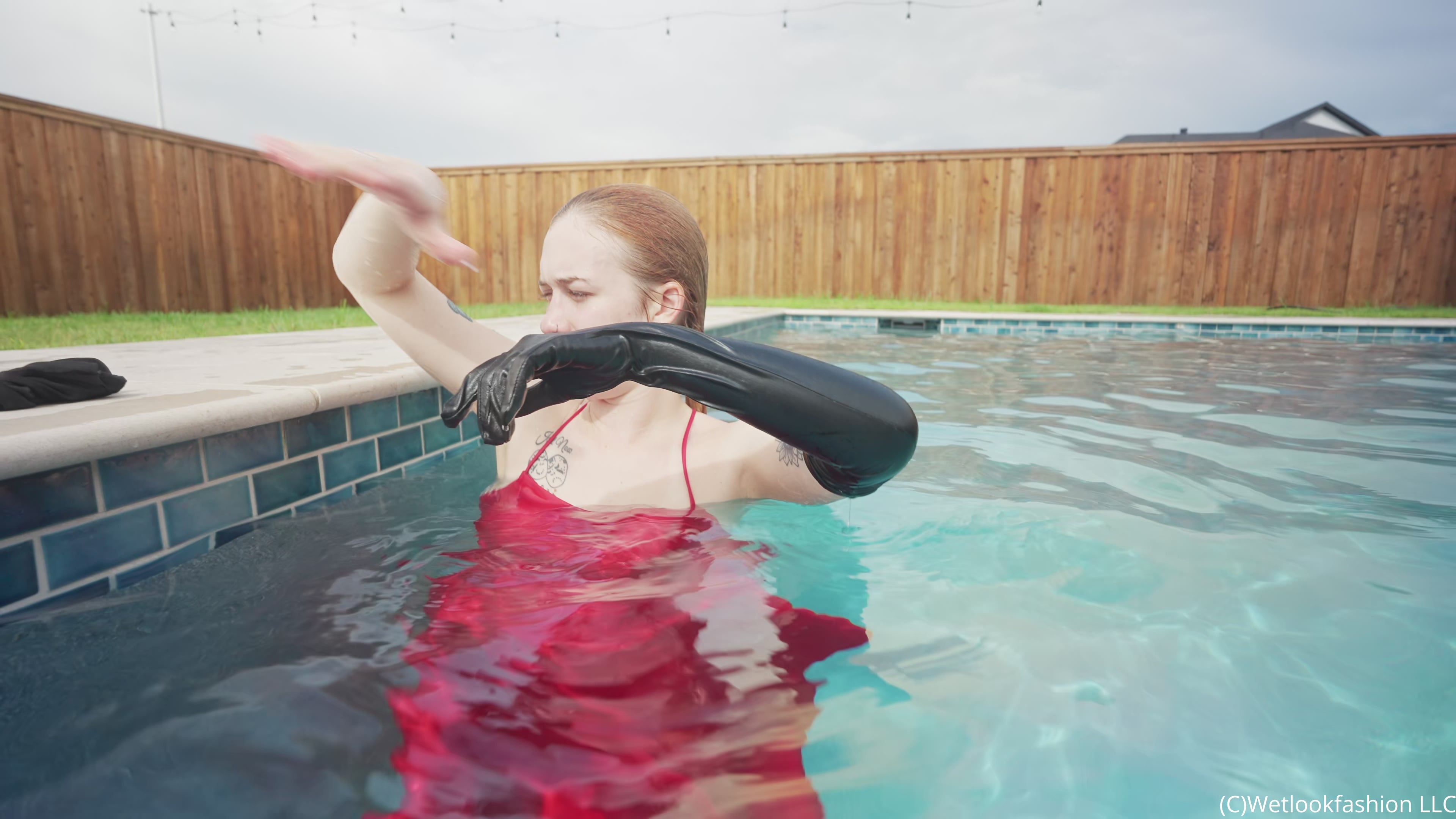 Jessica Has Some Pool Fun Wearing a Red Satin Dress