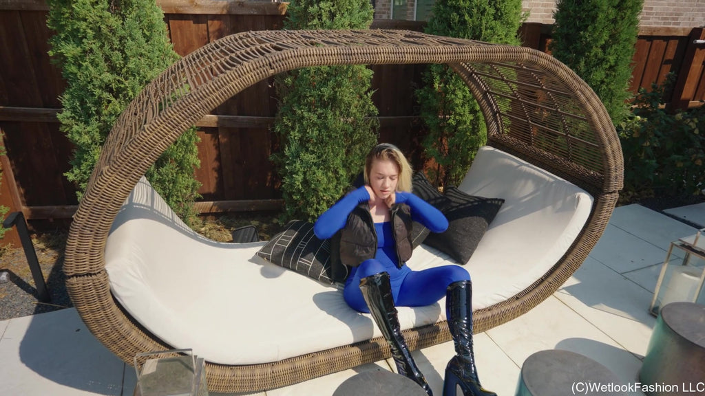 Jessica Takes a Dip Wearing a Jumpsuit, Boots and a Vest