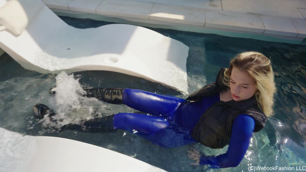 Jessica Takes a Dip Wearing a Jumpsuit, Boots and a Vest