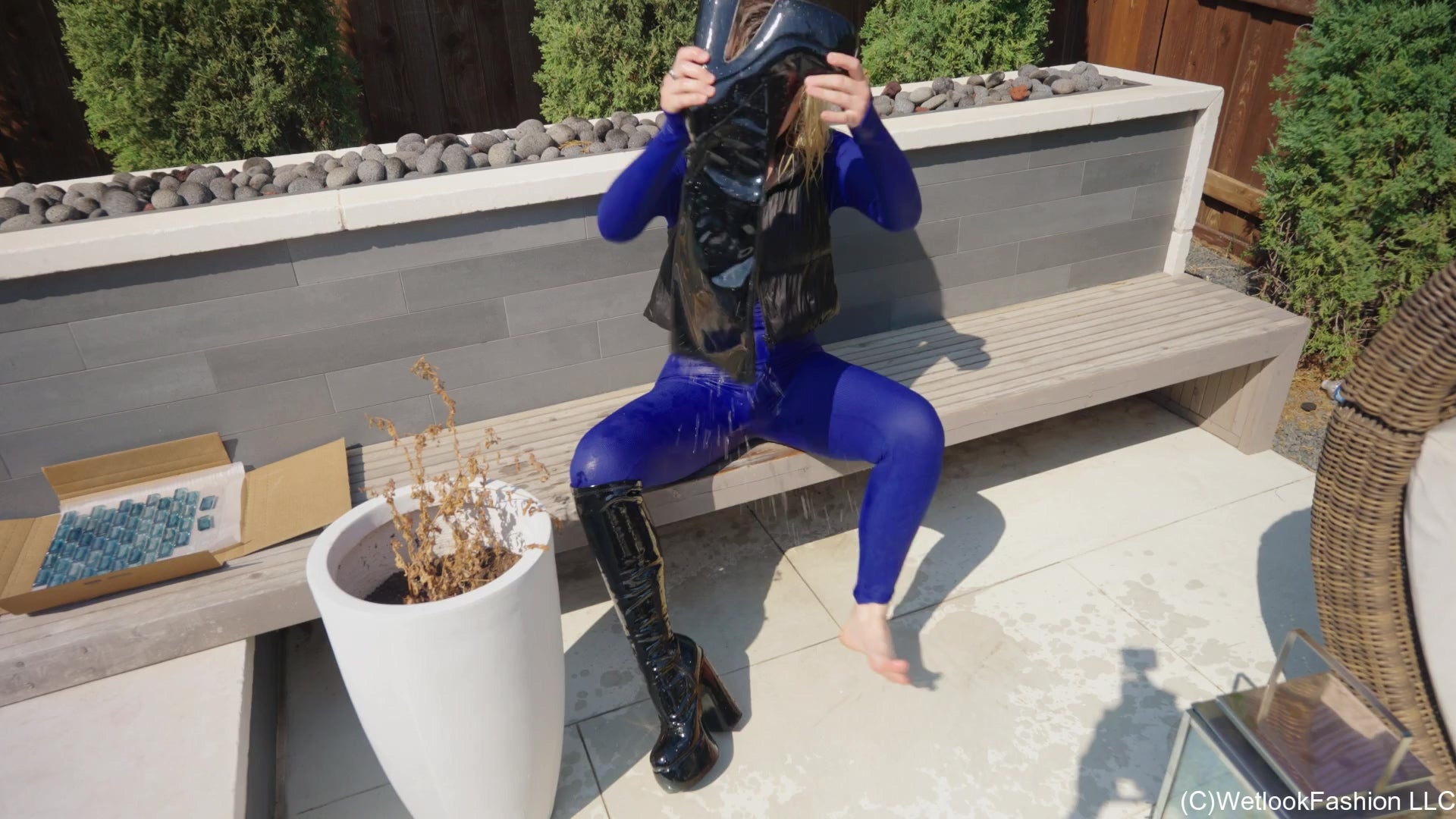 Jessica Takes a Dip Wearing a Jumpsuit, Boots and a Vest