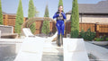 Jessica Takes a Dip Wearing a Jumpsuit, Boots and a Vest