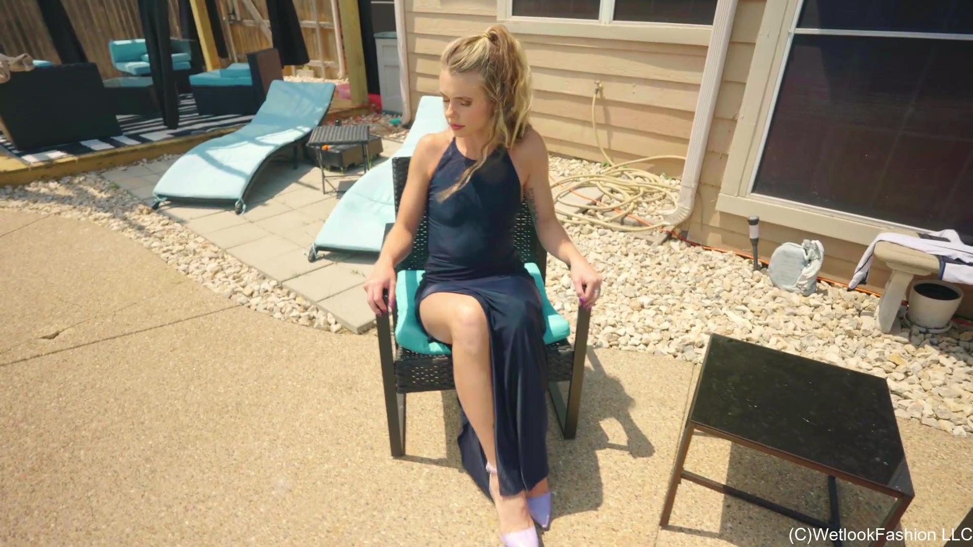 Joy in the Pool Wearing a Black Satin Dress