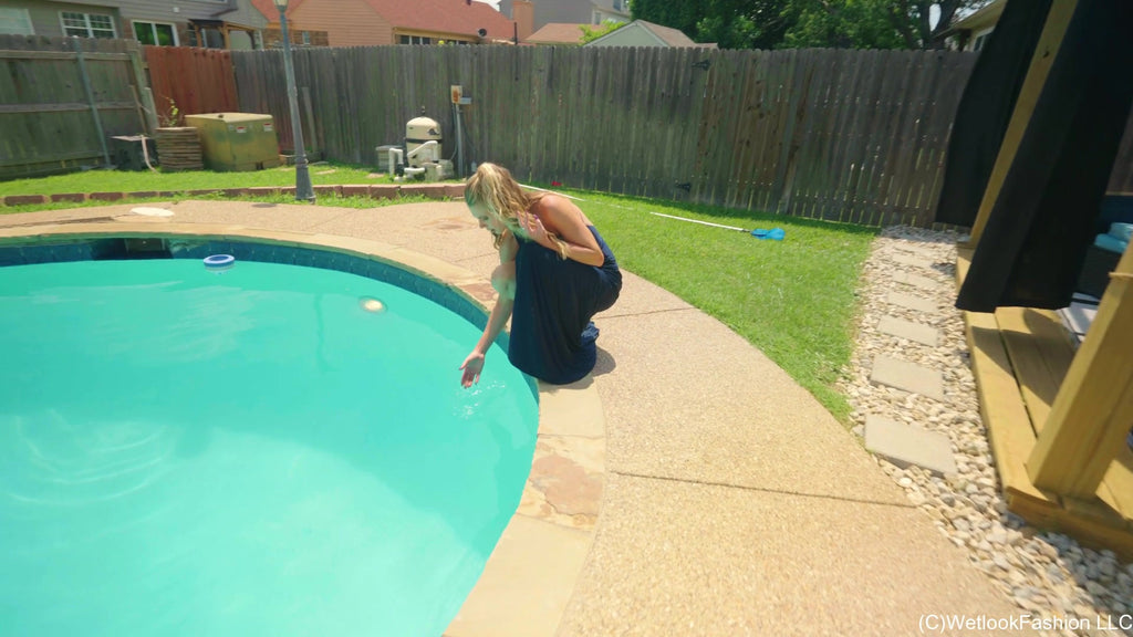 Joy in the Pool Wearing a Black Satin Dress