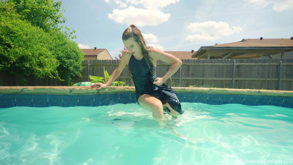 Joy in the Pool Wearing a Black Satin Dress