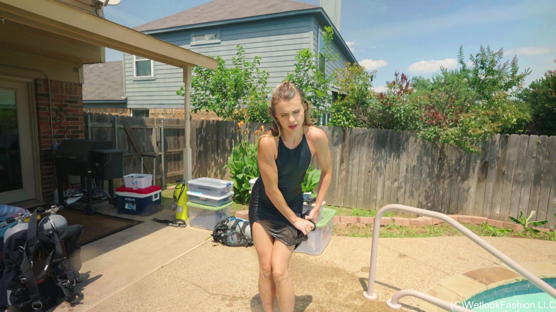 Joy in the Pool Wearing a Black Satin Dress
