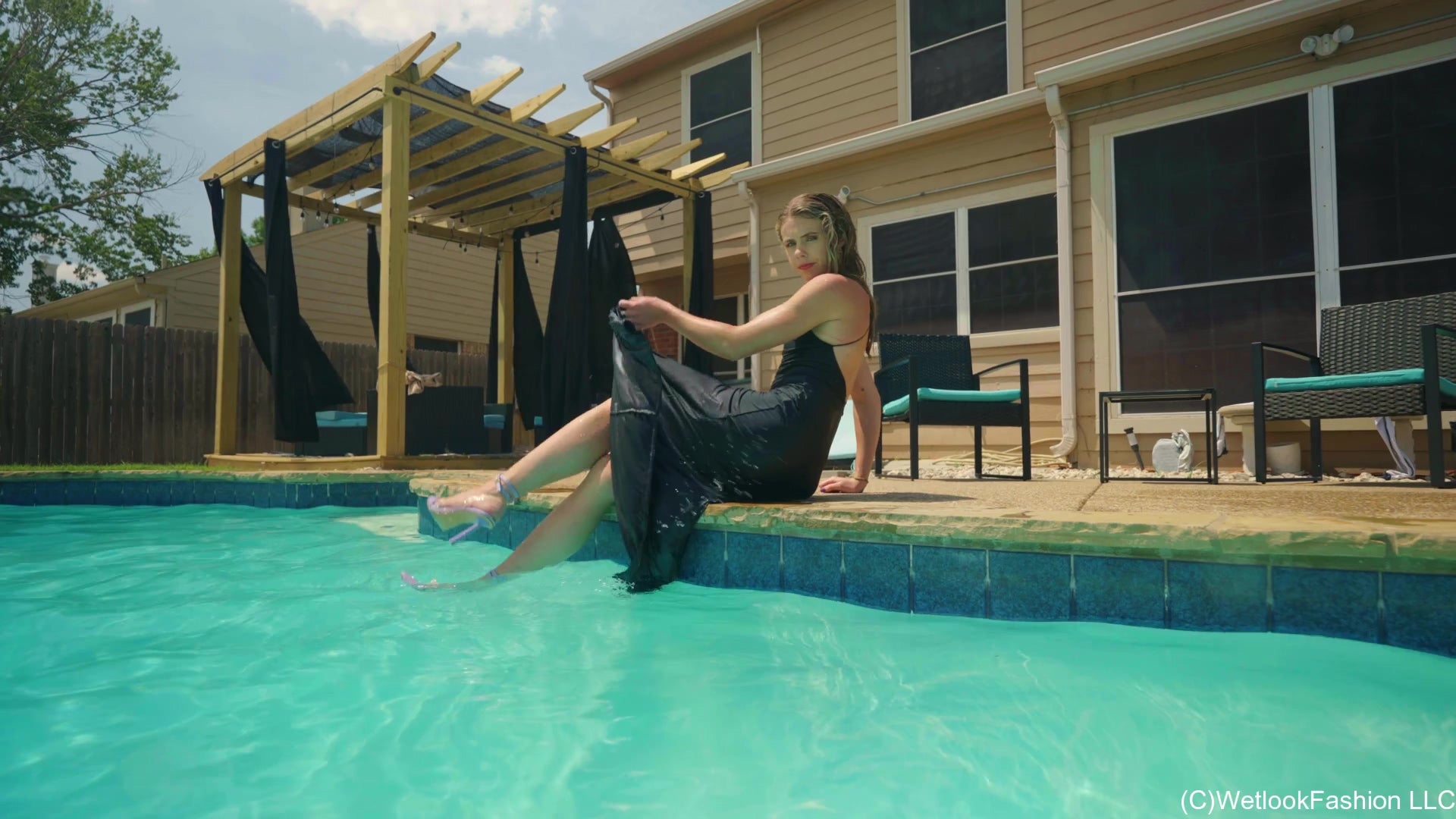 Joy in the Pool Wearing a Black Satin Dress