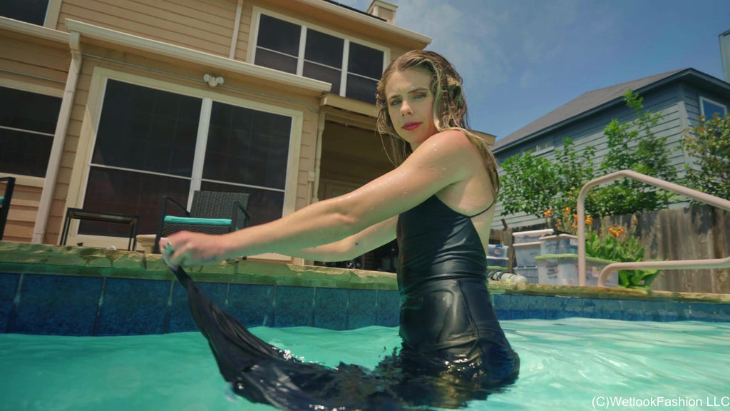 Joy in the Pool Wearing a Black Satin Dress