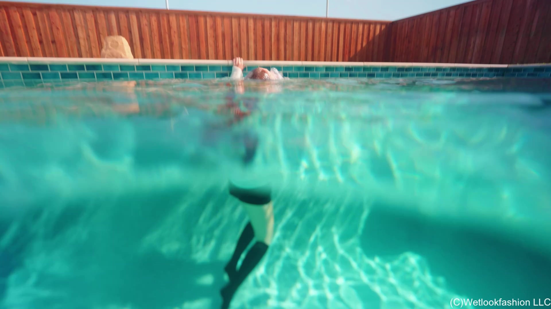 Kate Goes for a Swim in Leather, a Sweater, Socks and Boots