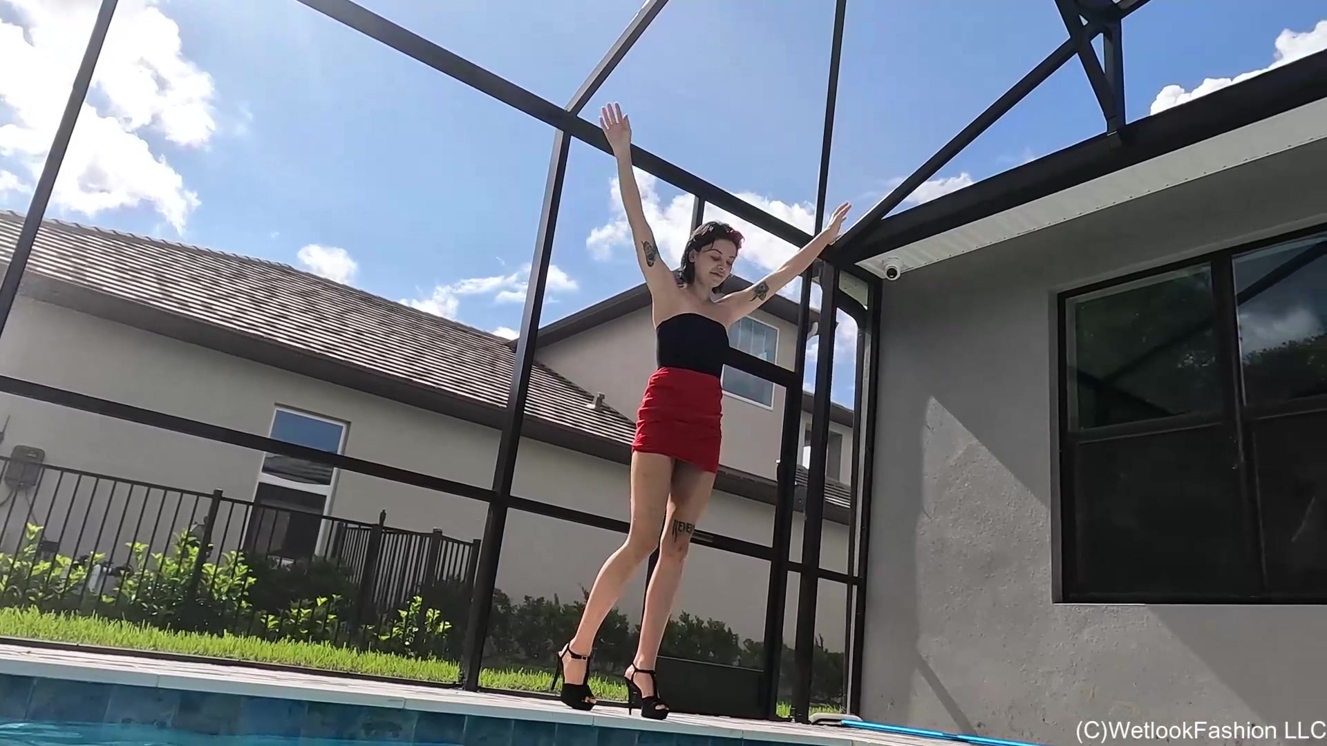 Kilo Takes a Dip in Her Red Mini Skirt and Black Top