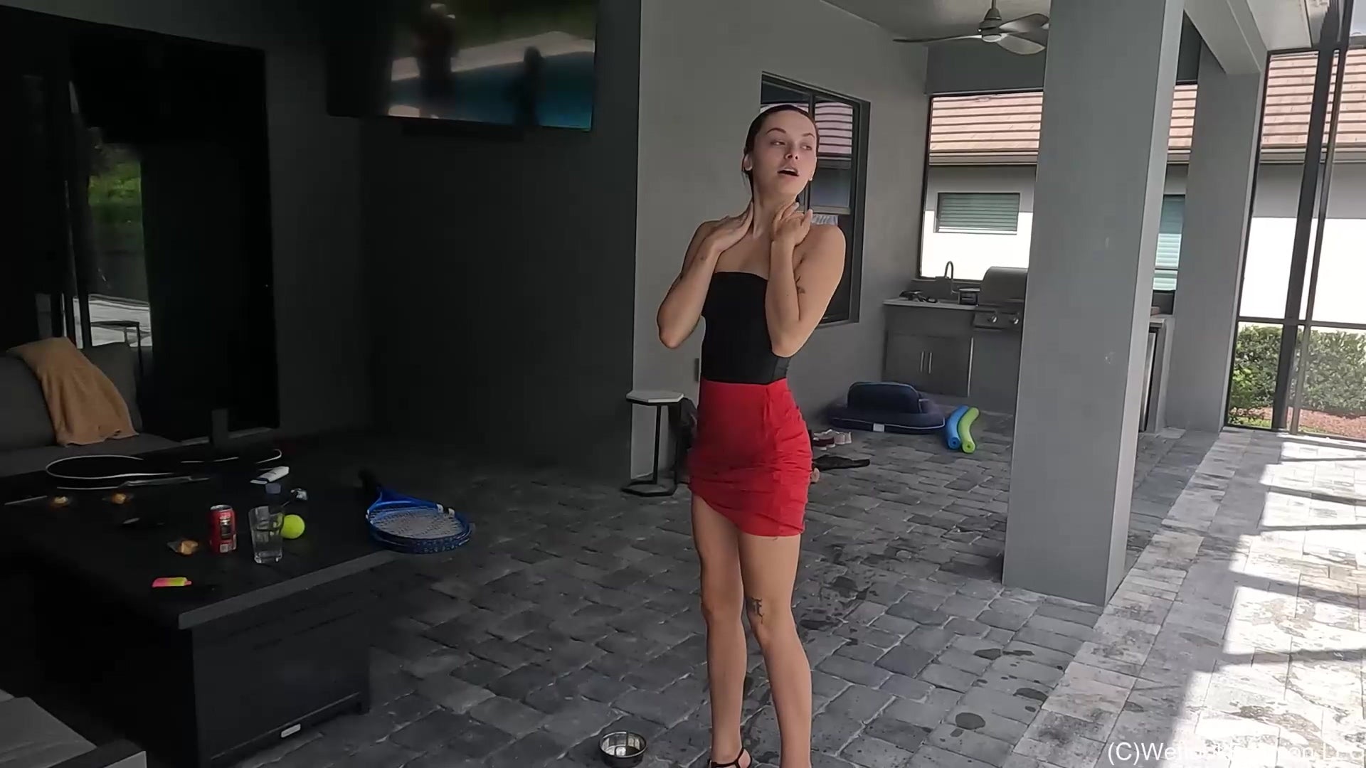 Kilo Takes a Dip in Her Red Mini Skirt and Black Top