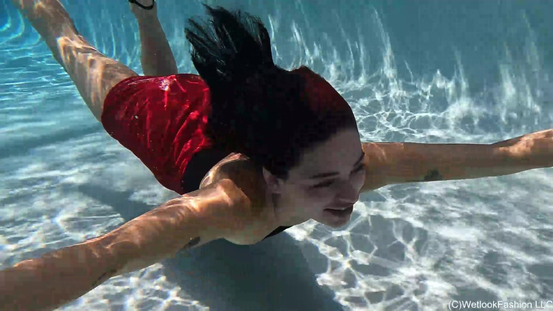 Kilo Takes a Dip in Her Red Mini Skirt and Black Top