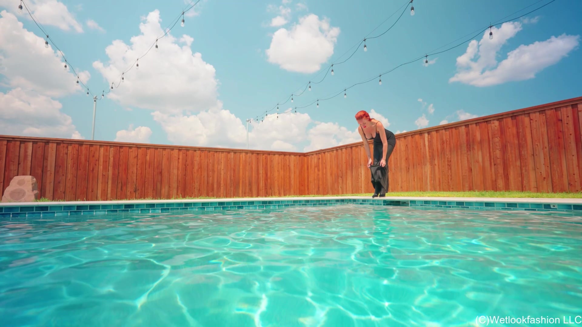Krispeachi Swims in a Shiny Black Maxidress