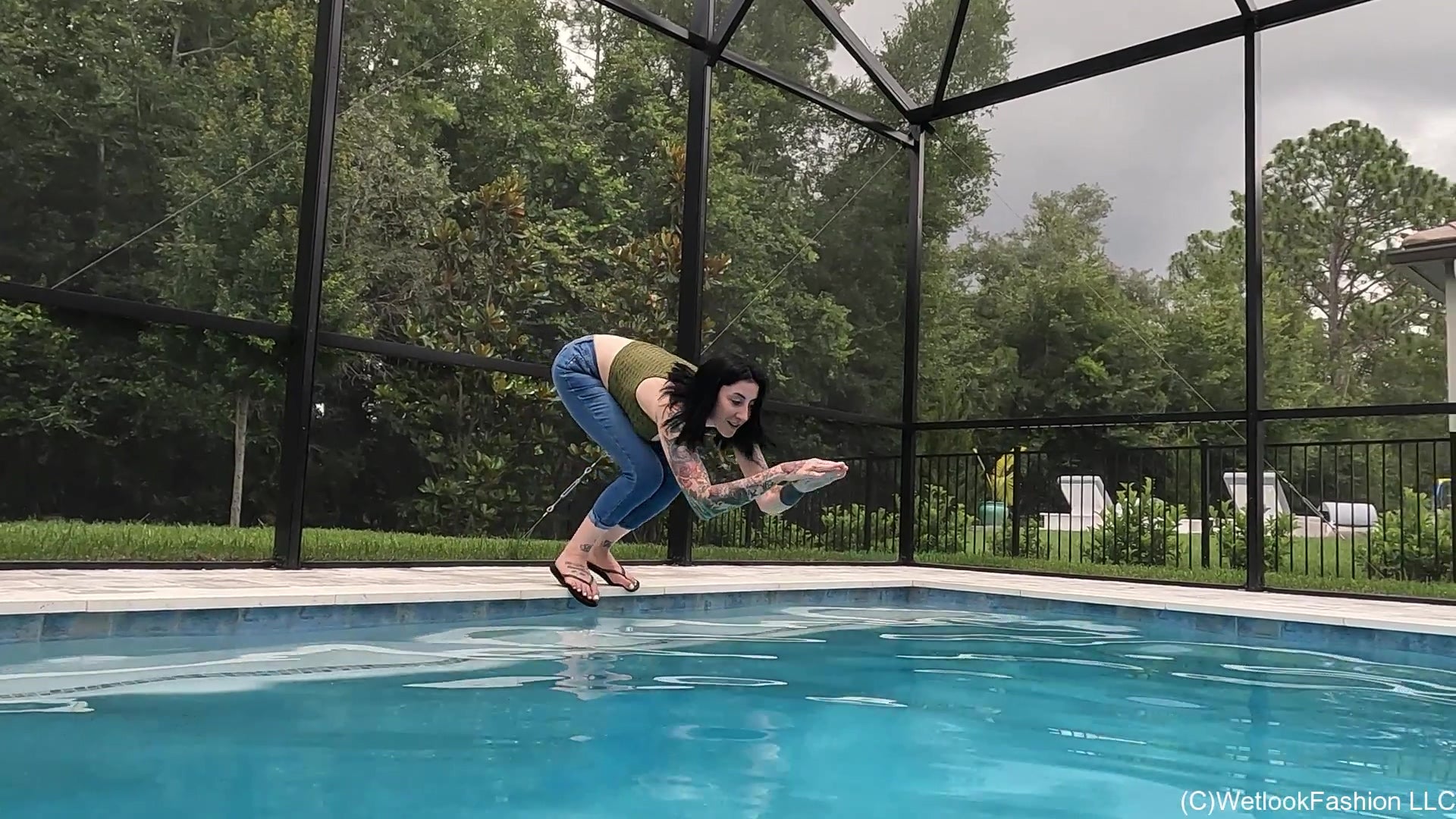 Lexie in the Pool Wearing Jeans, Crop Top and Flip Flops