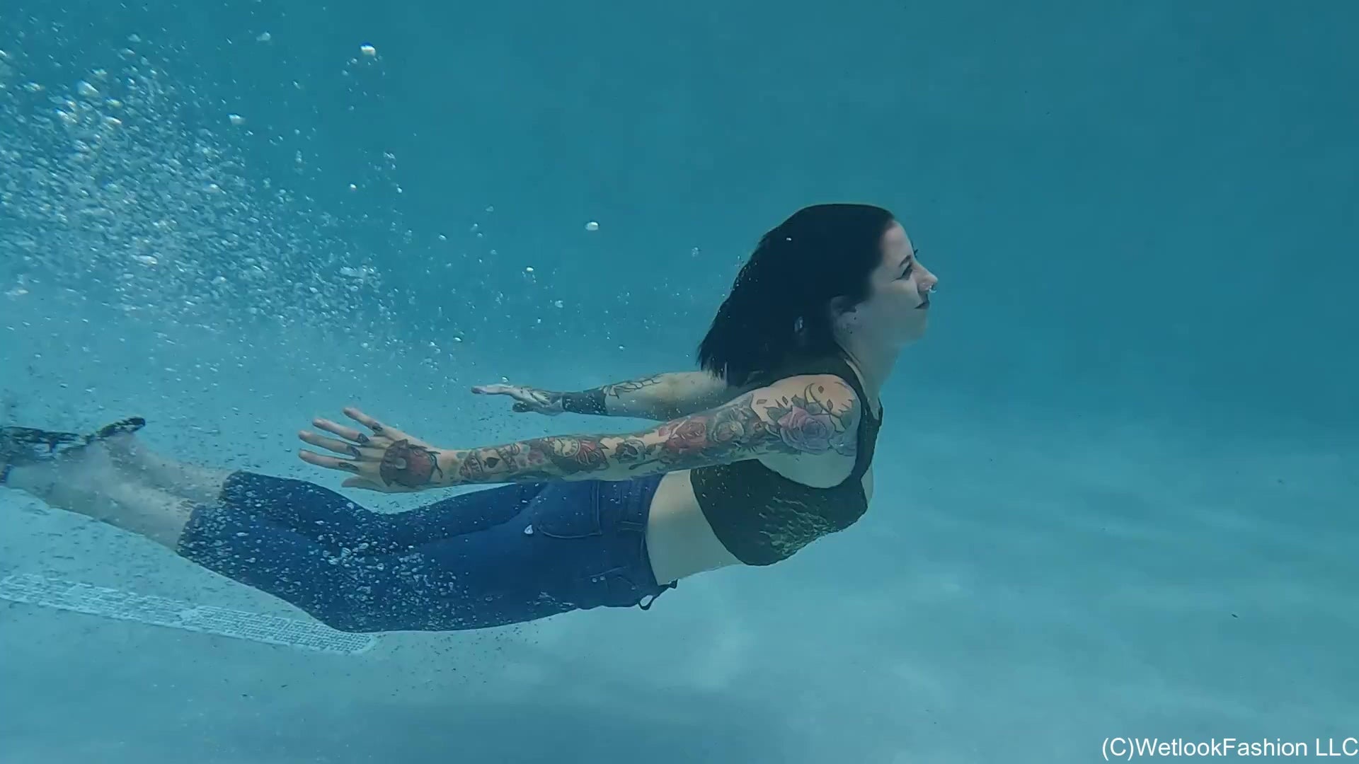 Lexie in the Pool Wearing Jeans, Crop Top and Flip Flops