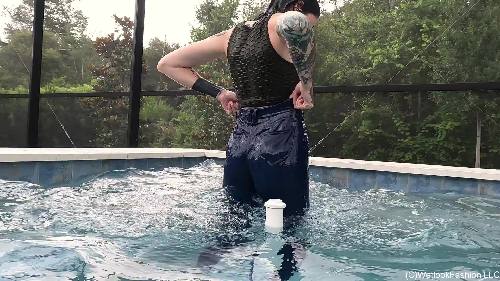 Lexie in the Pool Wearing Jeans, Crop Top and Flip Flops
