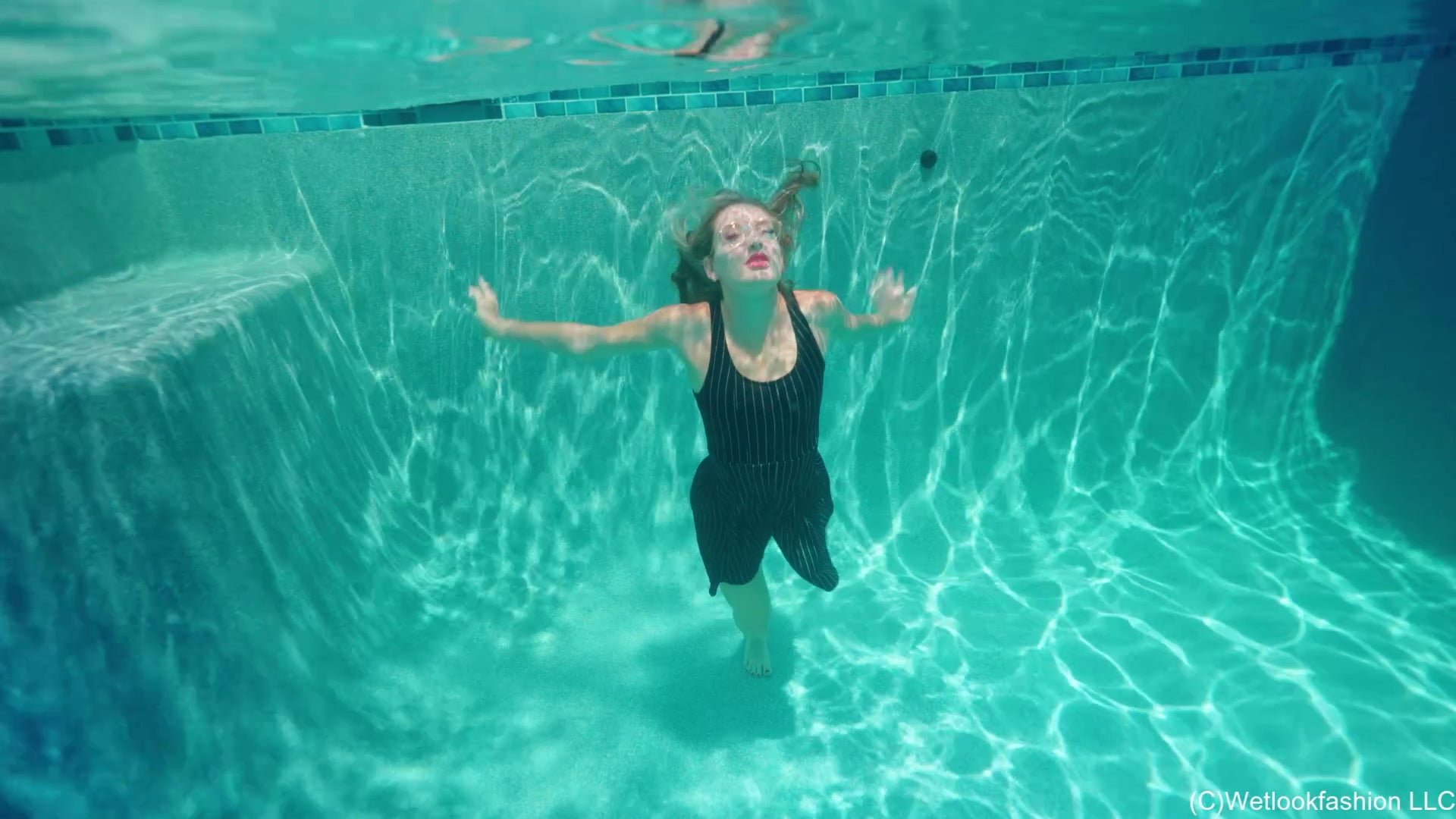 Lila Soaks Her Black Dress in the Pool