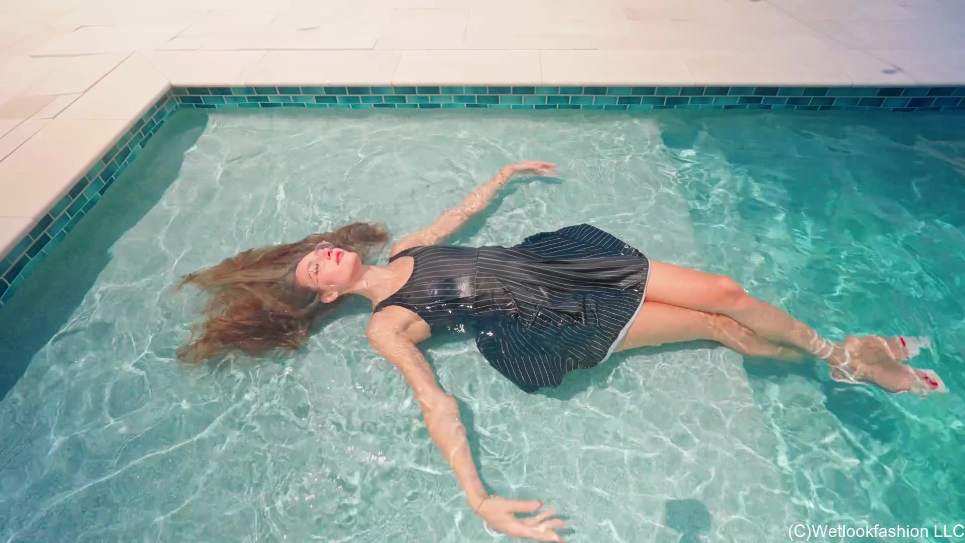Lila Soaks Her Black Dress in the Pool