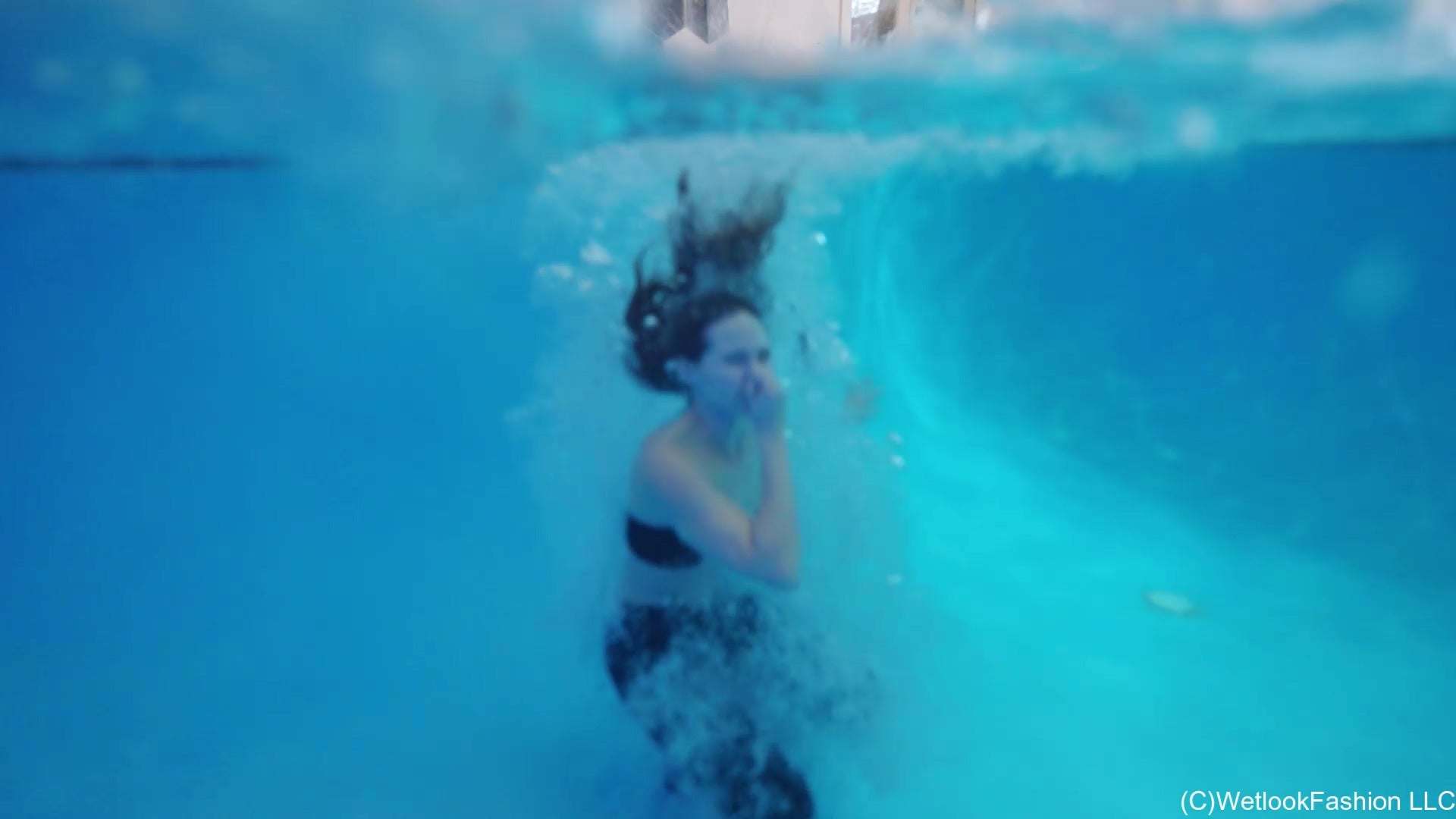 Lilith Rocks the Pool in Leather Pants and a Tube Top