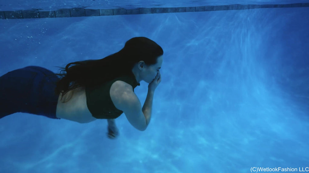 Lilith Swims in Flared Blue Jeans, Crop Top and High Heels